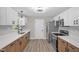 Updated kitchen with stainless steel appliances, modern countertops, and sleek white cabinetry at 1605 Nixon St, Durham, NC 27707