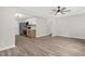 Contemporary living room with view of updated kitchen with stainless steel appliances at 1605 Nixon St, Durham, NC 27707