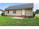 Back of house with brick foundation and concrete patio at 161 Bridgewater Dr, Erwin, NC 28339