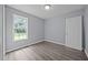 Cozy bedroom features wood floors, a window, and a neutral color palette at 161 Bridgewater Dr, Erwin, NC 28339