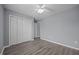 Bedroom features ample closet space, wood floors, and neutral-colored walls at 161 Bridgewater Dr, Erwin, NC 28339
