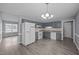Spacious kitchen featuring grey cabinets, white appliances, and wood flooring at 161 Bridgewater Dr, Erwin, NC 28339