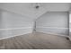 Spacious living room with vaulted ceilings, neutral paint, modern ceiling fan, and stylish gray laminate flooring at 161 Bridgewater Dr, Erwin, NC 28339