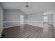 Open living room featuring vaulted ceilings, updated paint, trim detail and sleek, contemporary hard surface flooring at 161 Bridgewater Dr, Erwin, NC 28339