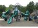 Community playground featuring slides and climbing structures for children to enjoy at 1911 Kudrow Ln, Morrisville, NC 27560