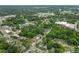 An aerial view of a lush, green neighborhood shows the close proximity of homes, businesses, and roadways at 1920 Hart St, Durham, NC 27703