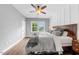 Cozy bedroom showcasing a ceiling fan and natural light at 1920 Hart St, Durham, NC 27703
