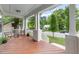 Inviting front porch featuring wood flooring, seating, and a view of the well-maintained street and neighborhood at 1920 Hart St, Durham, NC 27703
