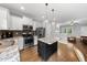 Modern kitchen with stainless steel appliances, granite countertops and large island at 1920 Hart St, Durham, NC 27703