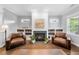 Cozy living room with built-in shelving and a fireplace, creating a warm and inviting atmosphere at 1920 Hart St, Durham, NC 27703