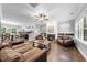 Spacious living room featuring hardwood floors, fireplace, and an open concept layout, perfect for entertaining at 1920 Hart St, Durham, NC 27703