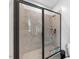 Modern tiled shower with glass door and recessed shelf at 1920 Hart St, Durham, NC 27703