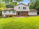 A view of the backyard, patio and exterior of the home at 204 Chatterson Dr, Raleigh, NC 27615
