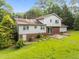 Aerial view of the home's backyard, showcasing the lawn and exterior at 204 Chatterson Dr, Raleigh, NC 27615