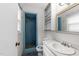 An outdated bathroom featuring a shower, sink, mirror, and storage at 204 Chatterson Dr, Raleigh, NC 27615