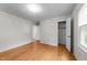 A spacious bedroom with hardwood floors, large window, and closet at 204 Chatterson Dr, Raleigh, NC 27615
