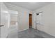 Bright bedroom featuring a window, a door to enter and tile flooring at 204 Chatterson Dr, Raleigh, NC 27615