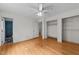 Bedroom with hardwood floors, ceiling fan, and access to a bathroom at 204 Chatterson Dr, Raleigh, NC 27615