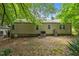 Exterior backyard featuring siding, air conditioning unit, and mature trees at 212 Plum St, Burlington, NC 27215