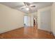 Neutral bedroom with hardwood floors, ceiling fan, and two large closets at 212 Plum St, Burlington, NC 27215
