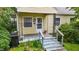 Inviting front porch with detailed ironwork, providing a charming entry to the home at 212 Plum St, Burlington, NC 27215