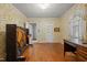 Cozy office space with floral wallpaper, natural light, and a vintage piano at 212 Plum St, Burlington, NC 27215