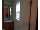 Bathroom featuring a vanity, a mirror, and natural light from the window at 221 Hickory Glen Ln, Durham, NC 27703