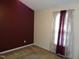 Bedroom featuring a neutral wall, an accent wall, and natural light from the window at 221 Hickory Glen Ln, Durham, NC 27703