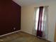 Bedroom featuring a neutral wall, an accent wall, and natural light from the window at 221 Hickory Glen Ln, Durham, NC 27703
