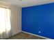 Bedroom featuring an accent wall and natural light from the window at 221 Hickory Glen Ln, Durham, NC 27703