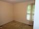 A carpeted bedroom offers a serene space with natural light streaming through the window at 221 Hickory Glen Ln, Durham, NC 27703