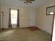 Inviting living room with neutral walls, ceiling fan, and natural light from the window at 221 Hickory Glen Ln, Durham, NC 27703
