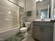 Clean bathroom featuring a shower-tub combo, neutral color scheme, and stylish vanity at 2417 Tobacco Root Dr, Raleigh, NC 27616
