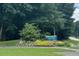 Buffaloe Road Athletic Park sign surrounded by colorful flowers and lush greenery at 2417 Tobacco Root Dr, Raleigh, NC 27616