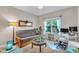 Inviting room featuring a futon, desk, and large window providing natural light, ideal for an office or guest room at 272 W Gennessee Dr, Zebulon, NC 27597