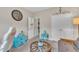 A functional space with versatile decor, with a desk and chair set in front of a glass-topped round table at 272 W Gennessee Dr, Zebulon, NC 27597