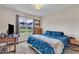 Comfortable bedroom with a bright window view, complemented by a wooden dresser and cozy decor at 272 W Gennessee Dr, Zebulon, NC 27597