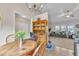 Bright dining area with a wooden table, chairs, and a hutch, connecting to a cozy living room at 272 W Gennessee Dr, Zebulon, NC 27597