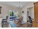 Bright dining area featuring a sliding door to a patio, adjacent to the kitchen, perfect for Gathering meals at 272 W Gennessee Dr, Zebulon, NC 27597