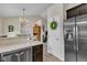 Modern kitchen featuring granite countertops, stainless steel appliances, and ample storage space at 272 W Gennessee Dr, Zebulon, NC 27597