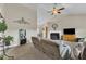 Spacious living room with high ceilings, a cozy fireplace, and ample seating, perfect for relaxing or entertaining guests at 272 W Gennessee Dr, Zebulon, NC 27597