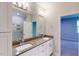 Bright bathroom featuring double sinks with a large mirror and light fixtures above a neutral countertop at 2735 Hunter Woods Dr # 571, Apex, NC 27502