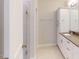 Bright bathroom featuring white cabinets, a shower with glass doors and neutral countertops and flooring at 2735 Hunter Woods Dr # 571, Apex, NC 27502