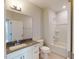 Bathroom with a vanity, toilet, and bathtub with shower at 2735 Hunter Woods Dr # 571, Apex, NC 27502