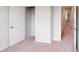 Bedroom with walk-in closet and neutral walls with light carpet throughout at 2735 Hunter Woods Dr # 571, Apex, NC 27502