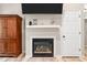 Living room featuring a fireplace with mounted tv and built-in cabinet at 2809 Titleist Dr, Hillsborough, NC 27278