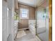 Bathroom with a glass shower and a jetted tub at 301 W Thorndale Dr, Oxford, NC 27565