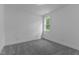 Bedroom features soft carpet, neutral paint, and a window with lots of natural light at 310 Hidden Lake Dr, Youngsville, NC 27596