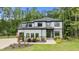 Stately two-story home with a stone facade, well-manicured landscaping, and inviting curb appeal at 310 Hidden Lake Dr, Youngsville, NC 27596
