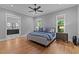 Spacious main bedroom with hardwood floors and ensuite bath with marble tile at 310 Hidden Lake Dr, Youngsville, NC 27596